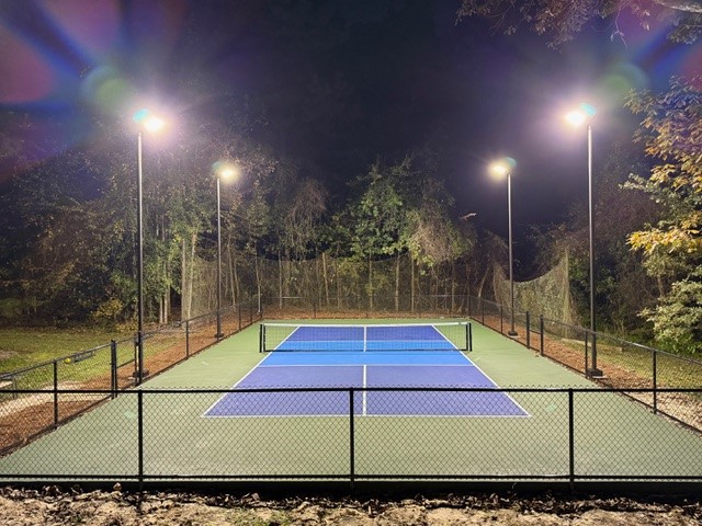 Outdoor Pickleball Court with Four Light Poles